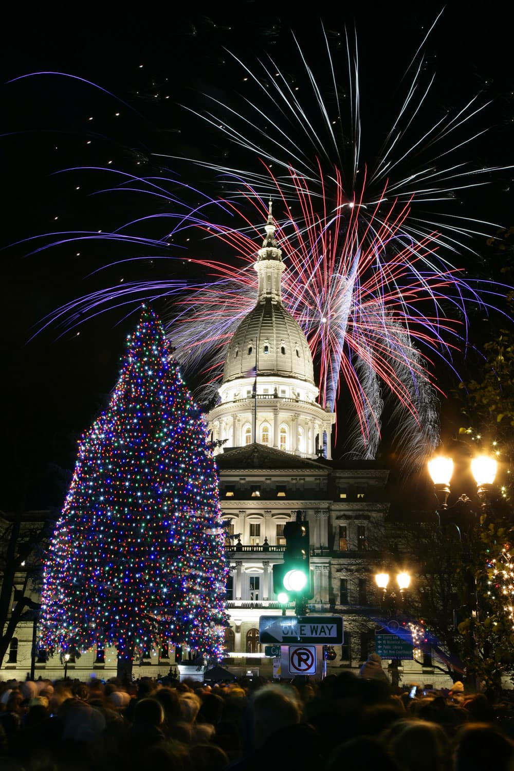 Fireworks explode over the state Capitol following a ceremony lighting the official state Christmas tree, in Lansing, Mich.