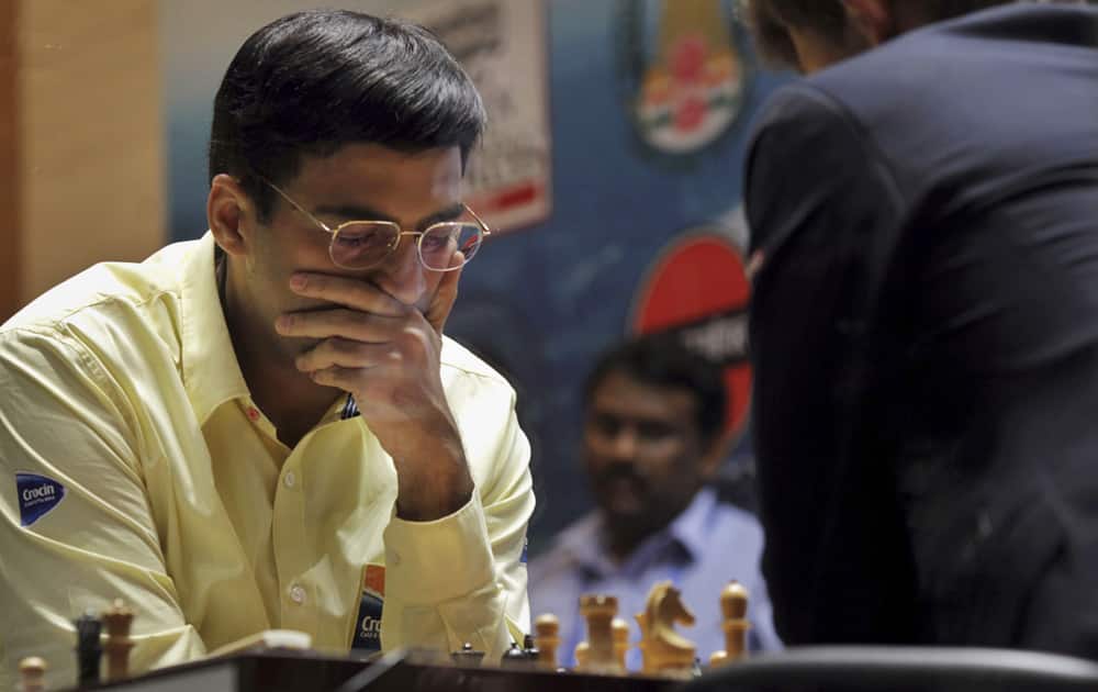 Reigning world chess champion India’s Viswanathan Anand thinks over his move as he plays against Norway’s Magnus Carlsen during the Chess World Championship match in Chennai.