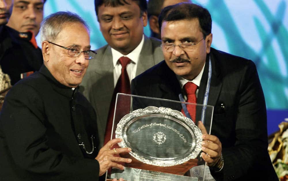 President Pranab Mukherjee receives a memento from Subodh Agarwal,President ICAI during International Conference on `Accountancy Profession-Emerging Frontiers of Future Growth` in Kolkata.