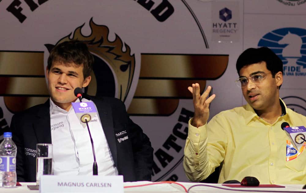 Viswanathan Anand of India and Magnus Carlsen of Norway during a press conference after their ninth match at FIDE World Chess Championship in Chennai.
