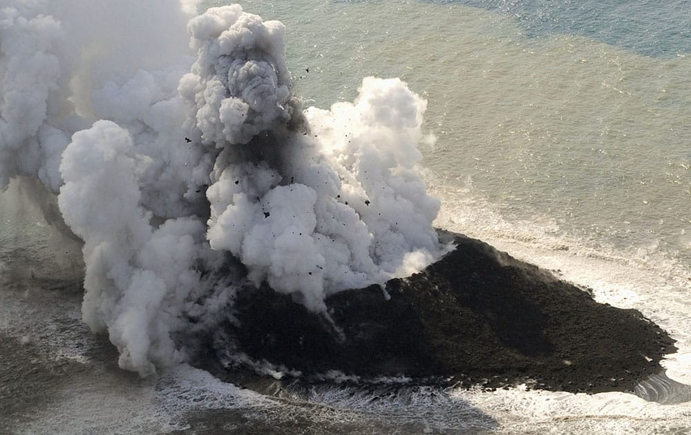 Smoke billows from a new island off the coast of Nishinoshima, a small, uninhabited island in the Ogasawara chain, far south of Tokyo.