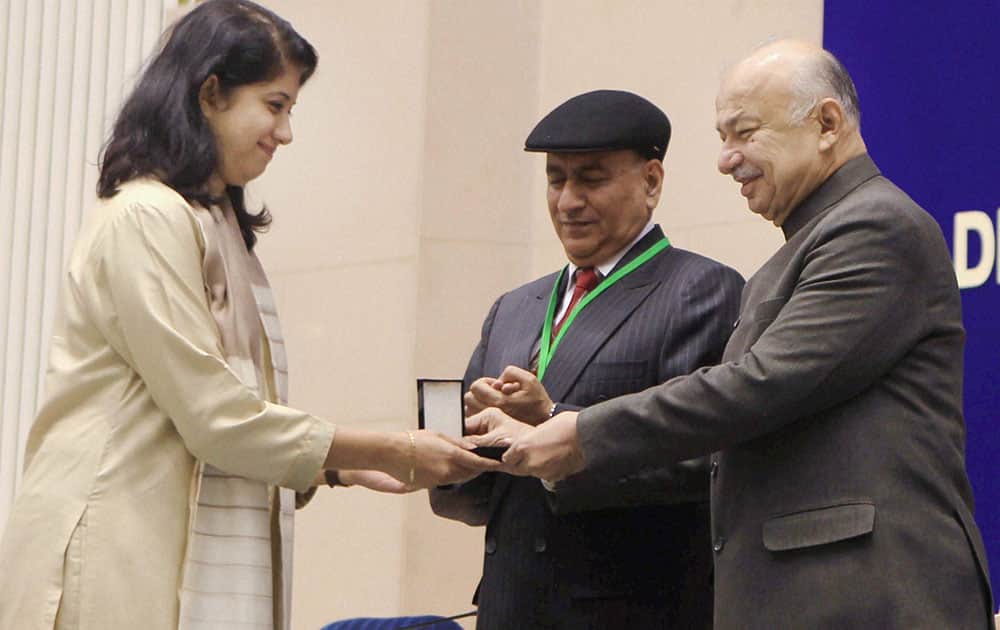 Union Home Minister Sushilkumar Shinde presenting the Police Medal for Meritorious Service, at the All India Conference of DGPs / IGPs at Vigyan Bhavan in New Delhi on Thursday. Home Secretary Anil Goswami is also seen.