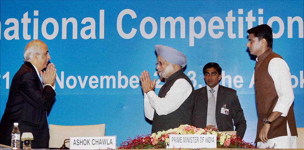 Prime Minister Manmohan Singh being greeted by Competition Commission of India chairman Ashok Chawla as Corporate Affairs Minister Sachin Pilot looks on during the inauguration of 3rd BRICS international Competition Conference in New Delhi.