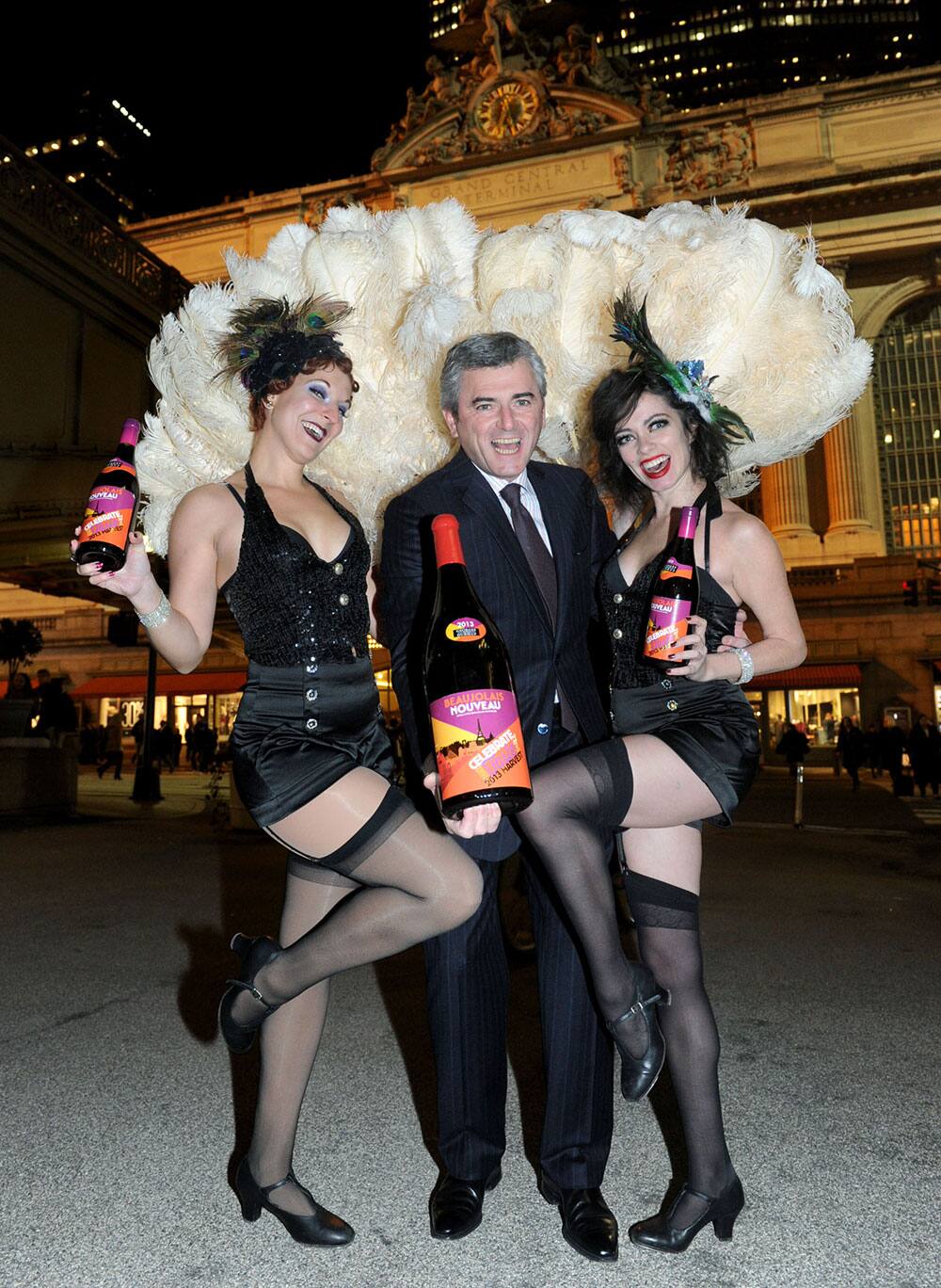 Franck Duboeuf, joined by Jazz Age dancers, unveils the first bottle of the 2013 Georges Duboeuf Beaujolais Nouveau in the US, outside Grand Central Terminal in New York.