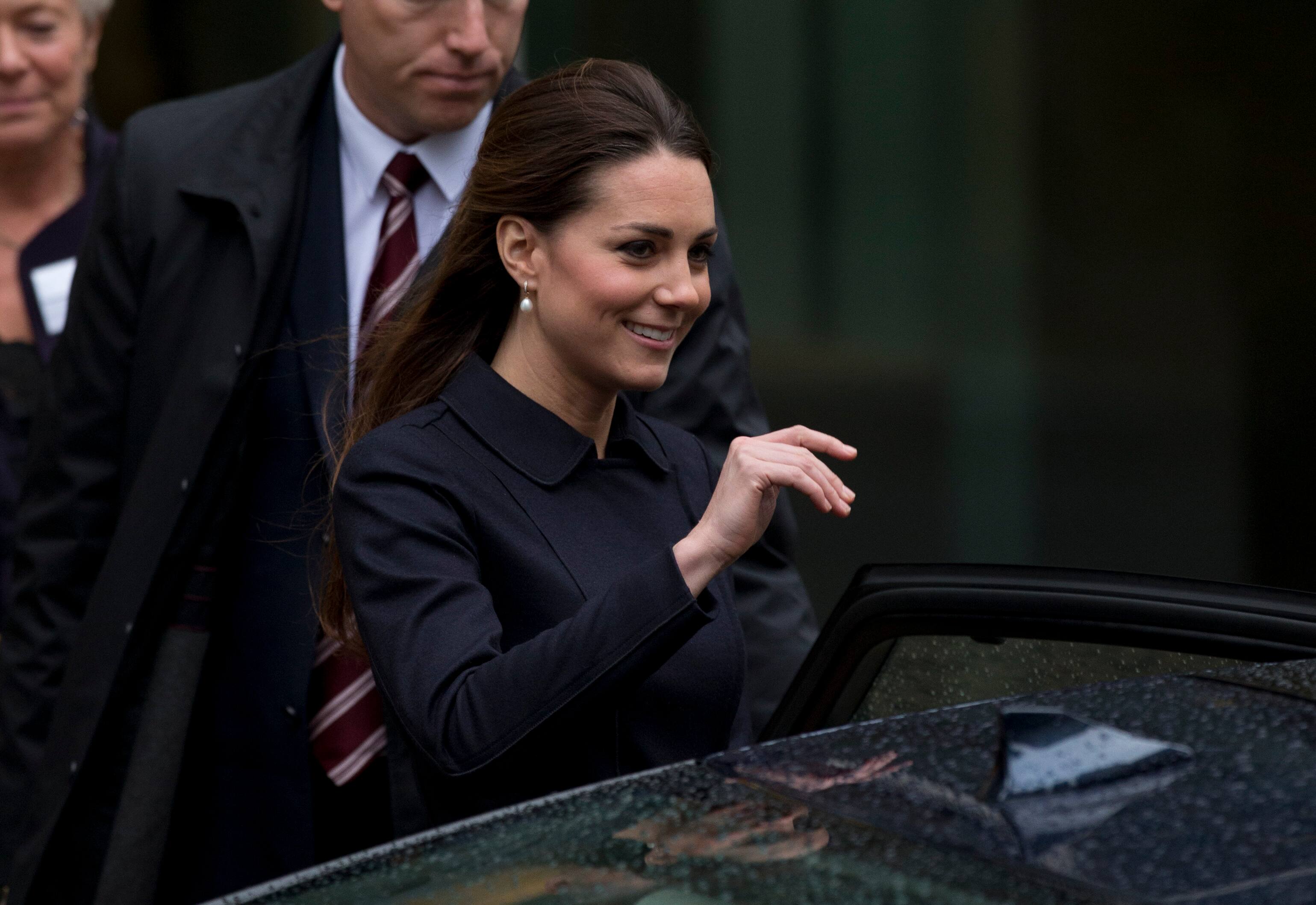 Kate the Duchess of Cambridge leaves after her charity visit to Clifford Chance in the Canary Wharf business district of London.