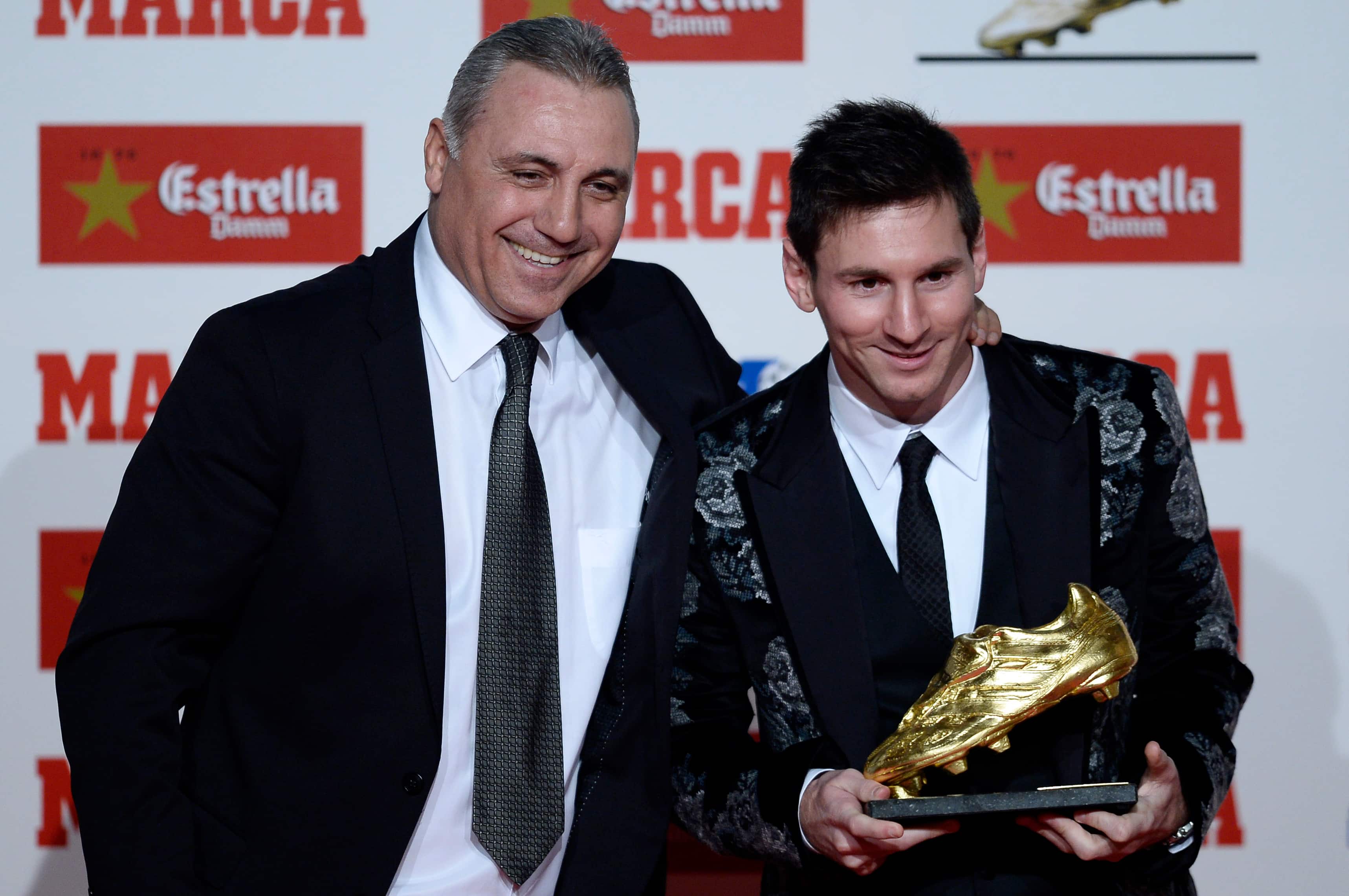 Former soccer player Hristo Stoichkov poses for the media with Barcelona`s Lionel Messi from Argentina after receiving the Golden Boot award for scoring the most goals in Europe`s domestic leagues last season in Barcelona.