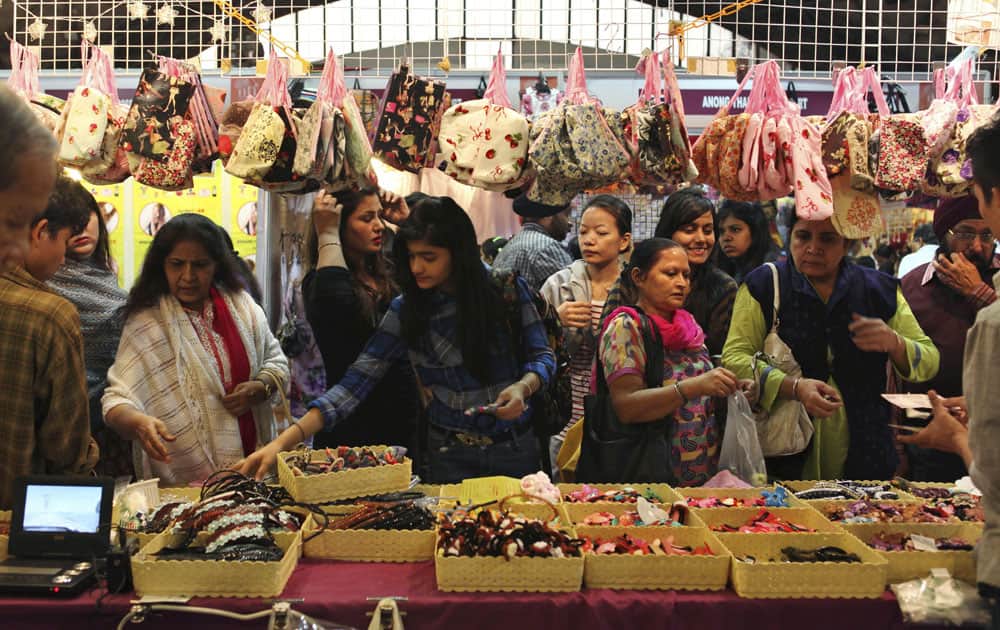 Indian visitors check out hair bands at a Thailand stall during the India International Trade Fair (IITF) in New Delhi.