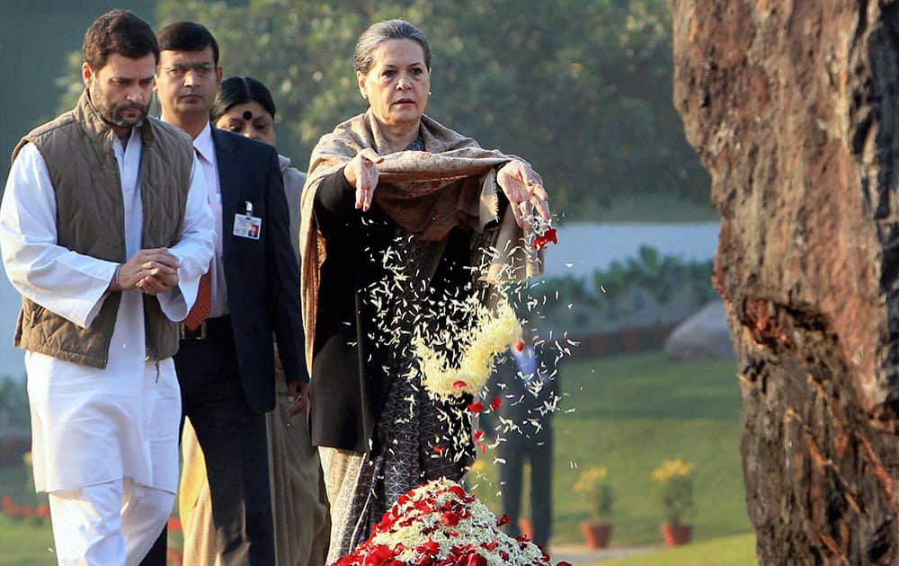 Congress party President Sonia Gandhi, right, pays floral tribute at the memorial of her mother-in-law and former Prime Minister Indira Gandhi, on her birth anniversary in New Delhi.