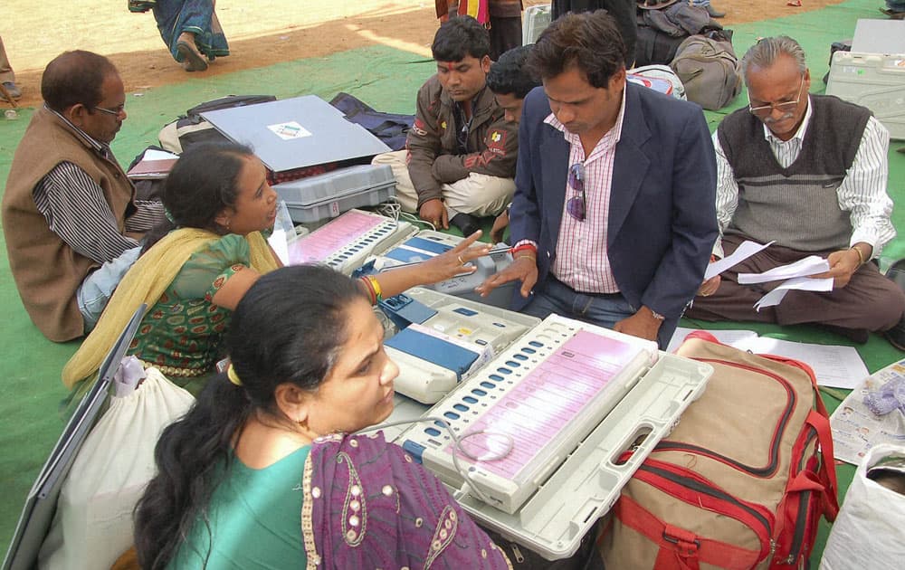 Polling officials at a distribution centre in Raipur on the eve of 2nd phase of polling in Chhattisgarh.