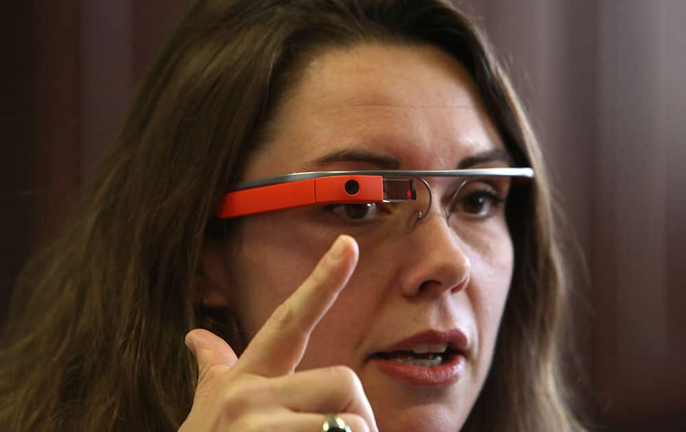 Dr. Heather Evans points to the new Google Glass device at Harborview Medical Center, in Seattle, Wash.