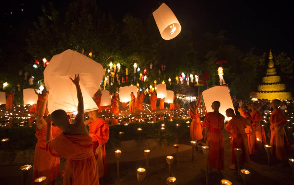Buddhist monks prepare to release sky lantern after a blessing ceremony during the Loy Krathong Festival at a temple in Chiang Mai, Thailand. Buddhist monks prepare to release sky lantern after a blessing ceremony during the Loy Krathong Festival at a temple in Chiang Mai, Thailand.