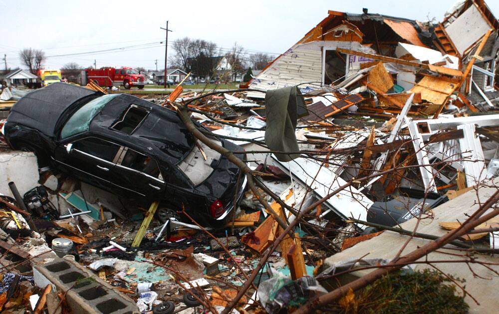 A car sits halfway in a basement at a leveled home near Home Avenue and Hoffer Street in Kokomo.