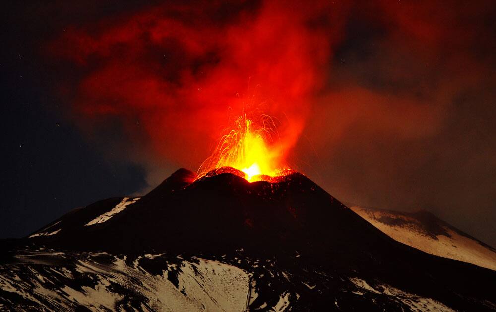Mt. Etna, Europe`s most active volcano, spews lava during an eruption as seen from Acireale, near the Sicilian town of Catania, Italy.