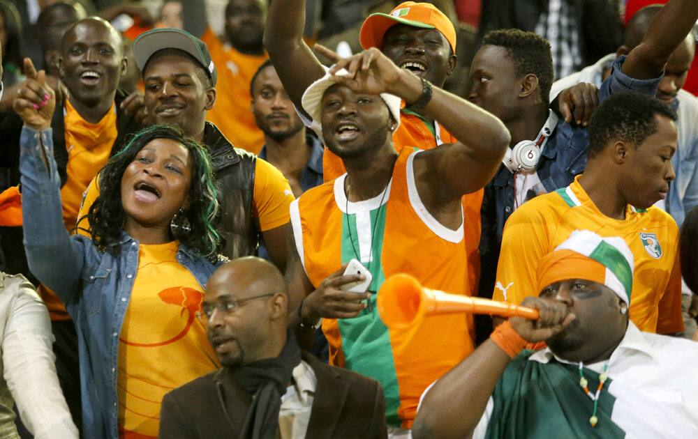 Supporters of Ivory Coast`s soccer team cheer after the team scored a goal in the World Cup 2014 qualifying match between Ivory Coast and Senegal at Mohammed V stadium in Casablanca, Morocco.
