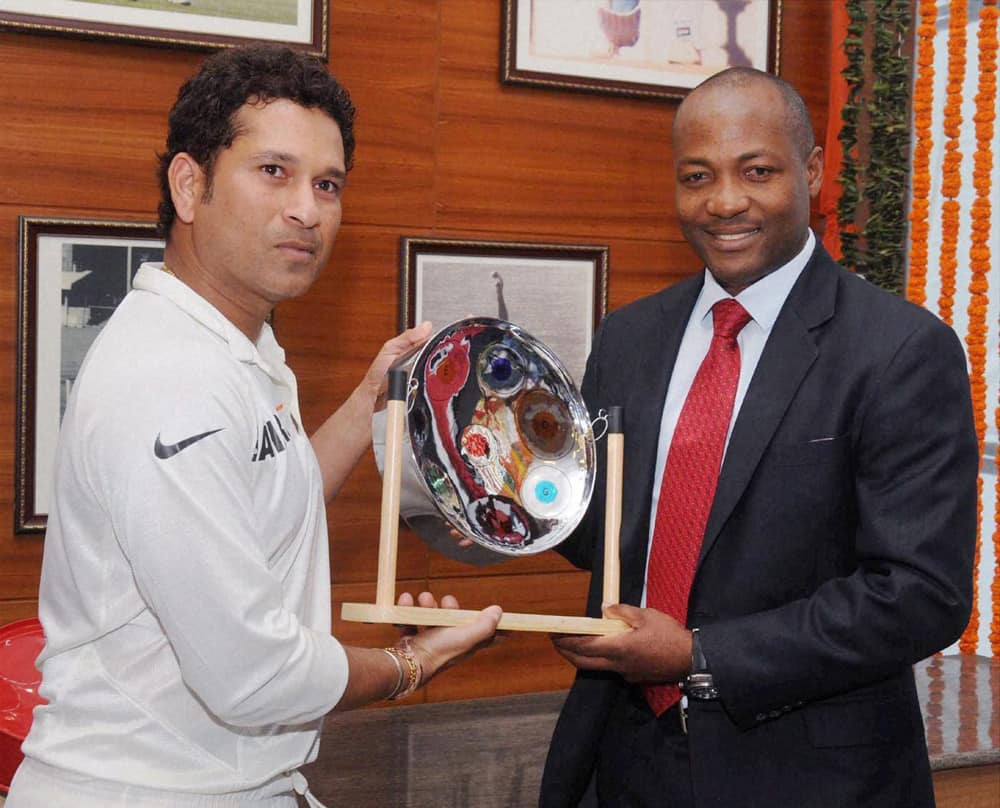 Batting legend Brian Lara felicitates Sachin Tendulkar on behalf of West Indies Cricket Board at Wankhede Stadium in Mumbai.