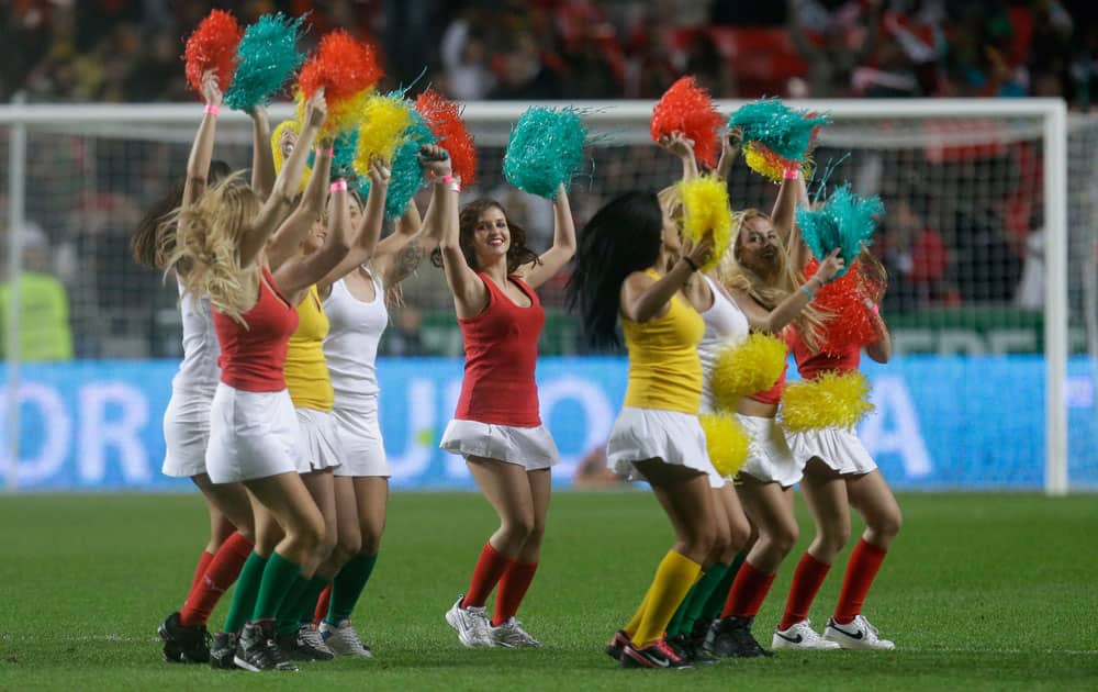 Cheerleaders entertain the spectators before the World Cup qualifying playoff first leg soccer match between Portugal and Sweden.