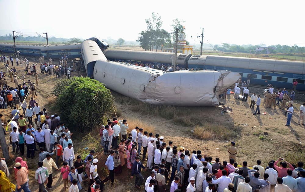 People gather at the site of a train accident near Nashik, 165 kilometers (100 miles) north of Mumbai.
