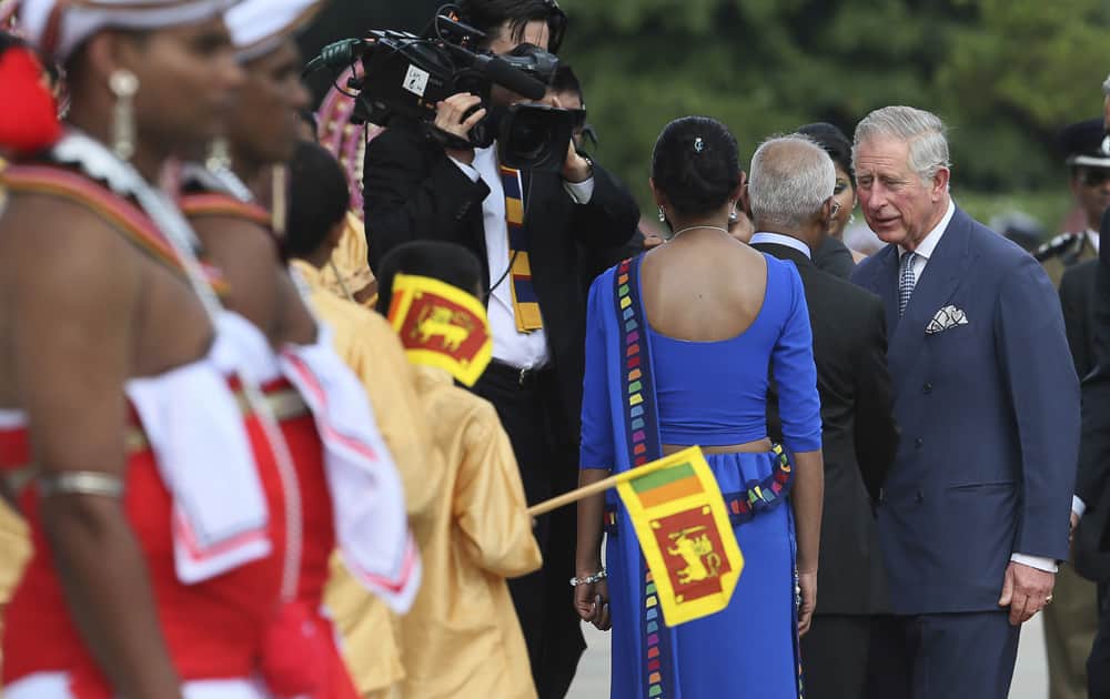 Britain`s Prince Charles talks to an official of the Commonwealth nations as he arrives at the Nelum Pokuna Mahinda Rakapaksa theater, the main venue for the opening ceremony of the Commonwealth Heads of Governments meeting, in Colombo, Sri Lanka.