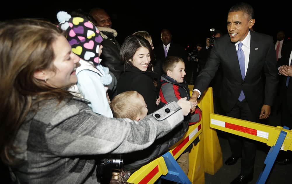 President Barack Obama greets guests on the tarmac upon his arrival at Philadelphia International Airport.