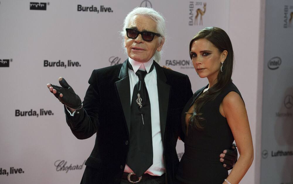 Victoria Beckham poses with Karl Lagerfeld after being awarded during the Bambi 2013 media awards in Berlin, Germany.