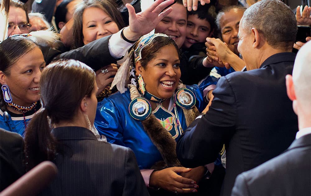 President Barack Obama shakes hands with audience members after speaking at the 2013 Tribal Nations Conference, at the Interior Department in Washington.