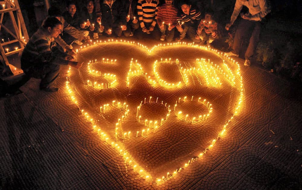 People light candles that read Sachin Tendulkar 200 on the eve of his last 200th test match in Moradabad.