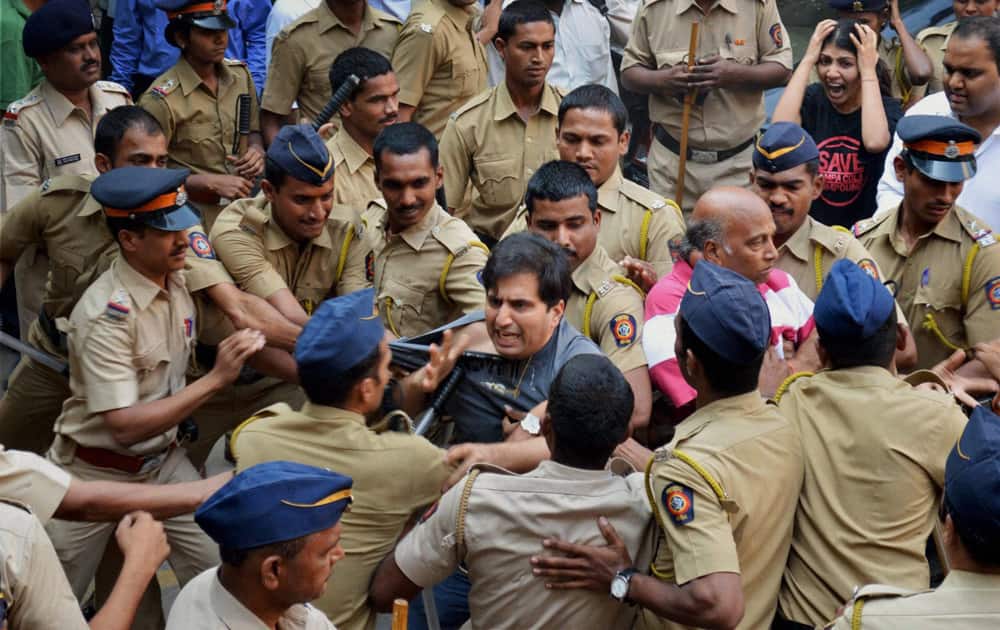 Police in action against residents of Campa Cola housing colony who were protesting demolition of their colony in Mumbai.