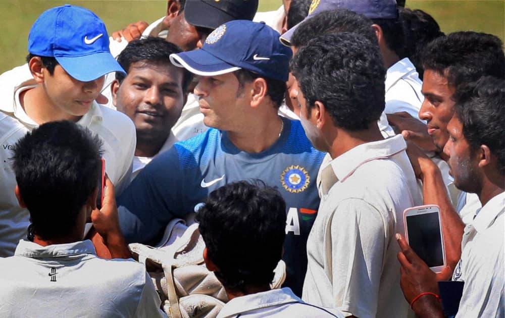 Master blaster Sachin Tendulkar with fans during a practice session in Mumbai on Wednesday ahead of the 2nd test match against West Indies.