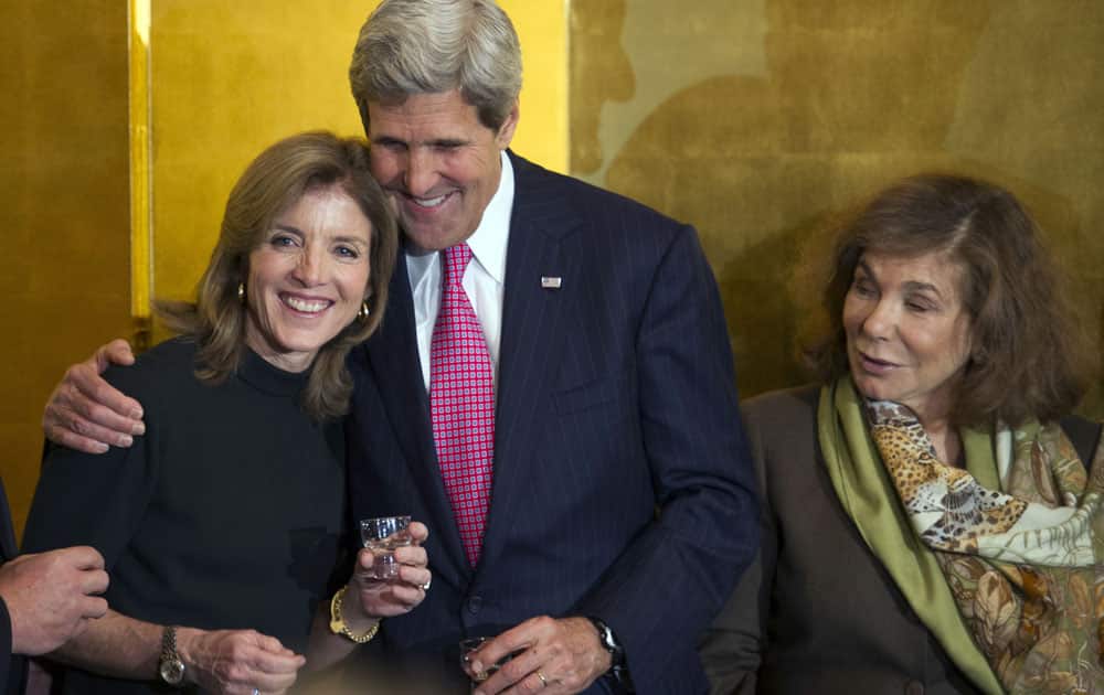 Secretary of State John Kerry hugs U.S. Ambassador to Japan Caroline Kennedy, as his wife Teresa Heinz Kerry, right, watches during a reception at the Japanese Ambassador`s residence in Washington.