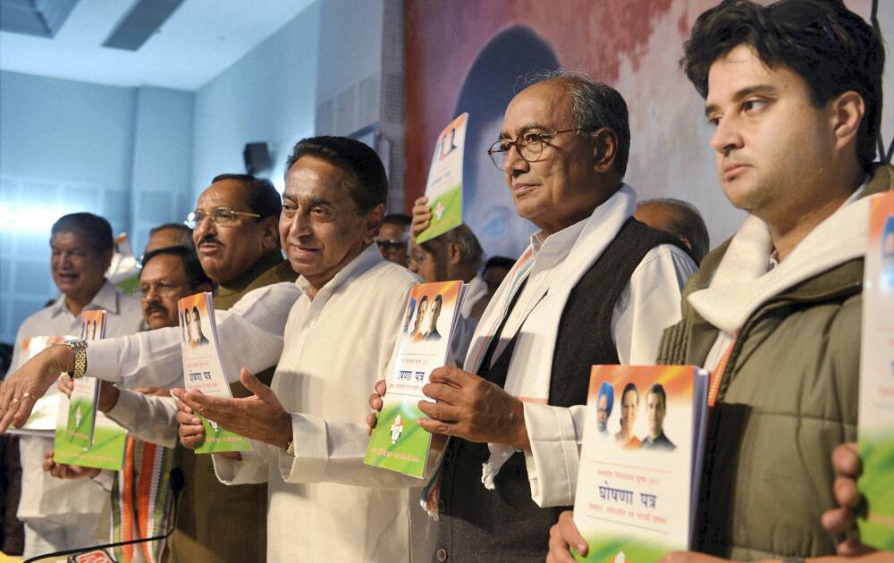 Jyotiraditya Scindia, Digvijay Singh, Kamal Nath and Harish Rawat release the party`s `Election Manifesto` for Assembly Elections 2013, in Bhopal.