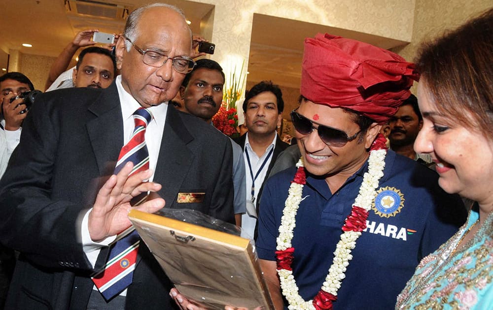 MCA, President Sharad Pawar (L) with Sachin Tendulkar and his wife Anjali (R) during the Mumbai Cricket Association`s Sachin Tendulkar Gymkhana naming function at Kandivali, North Mumbai.