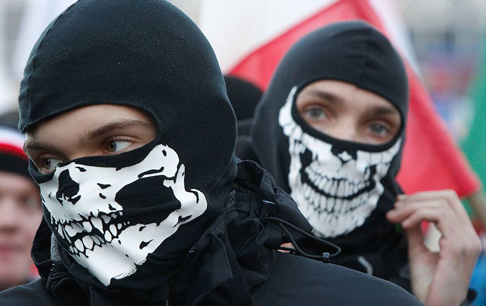 Protesters take part in an annual march through central Warsaw city to mark the 95th anniversary of Poland`s Independence Day in Warsaw, Poland.