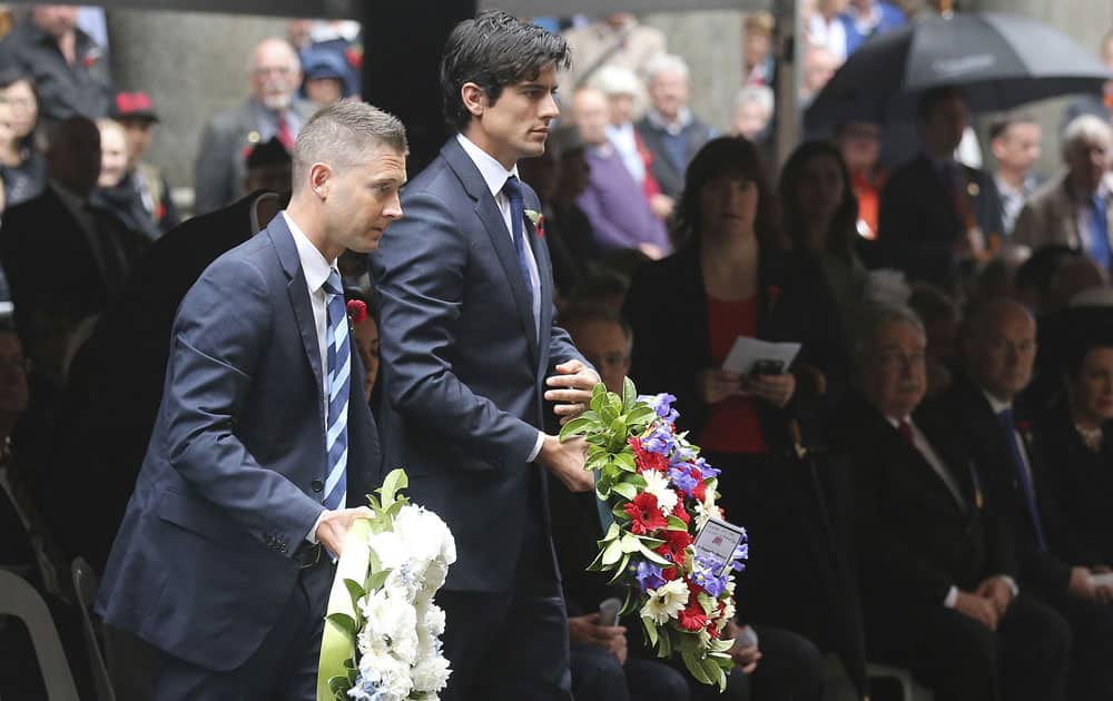 England`s cricket team captain Alastair Cook, right, and Australia`s captain Michael Clarke lay wreaths during a Remembrance Day ceremony in Sydney in Australia.