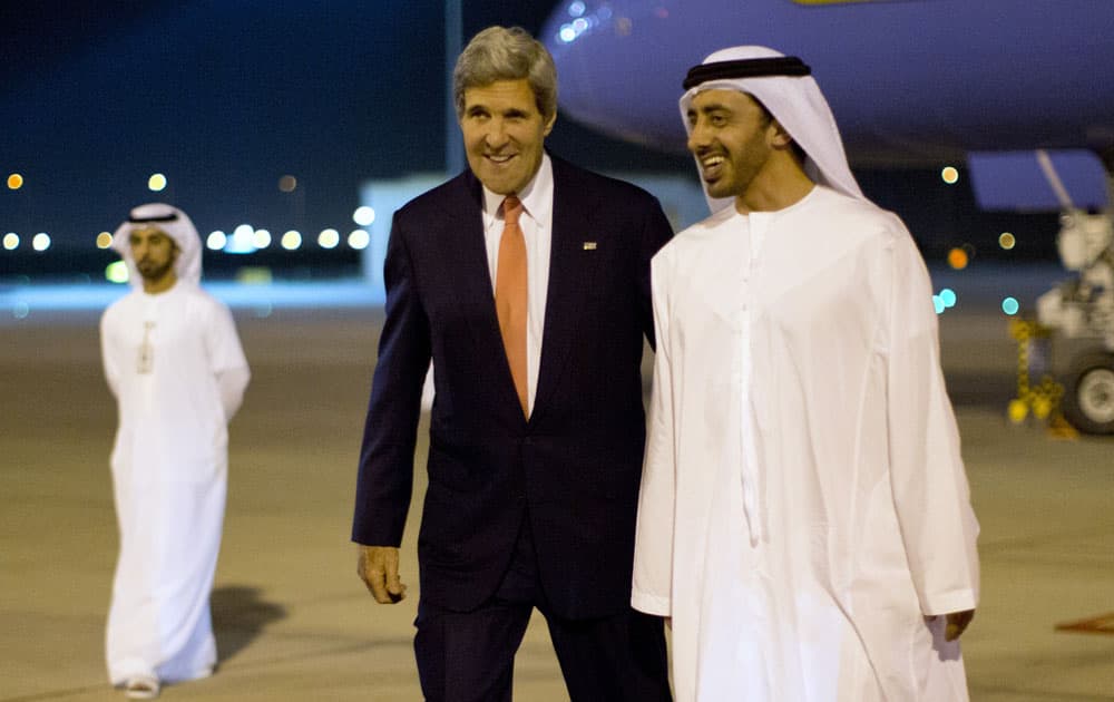 US Secretary of State John Kerry, left, is greeted by United Arab Emirates Foreign Minister Sheik Abdullah Bin Zayed Al Nahyan upon his arrival to Abu Dhabi, United Arab Emirates.