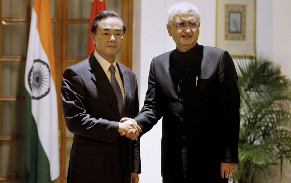 External Affairs Minister Salman Khurshid with his Chinese counterpart Wang Yi before a meeting at Hyderabad house in New Delhi.