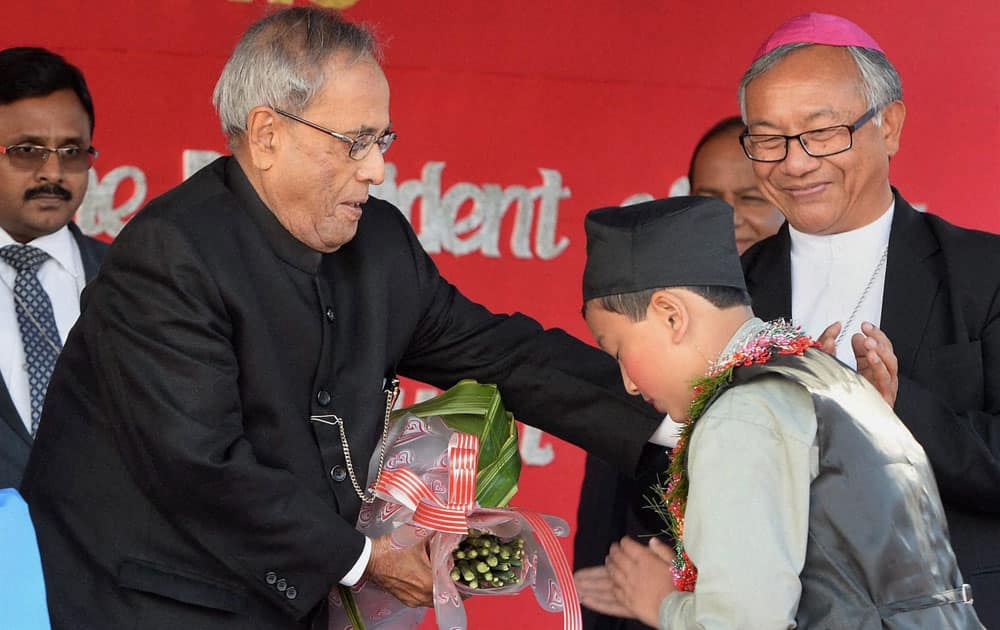 President Pranab Mukherjee being welcomed by a student during the inauguration of 125th Year Jubilee Celebrations of ST Joseph`s School at Darjeeling in West Bengal.
