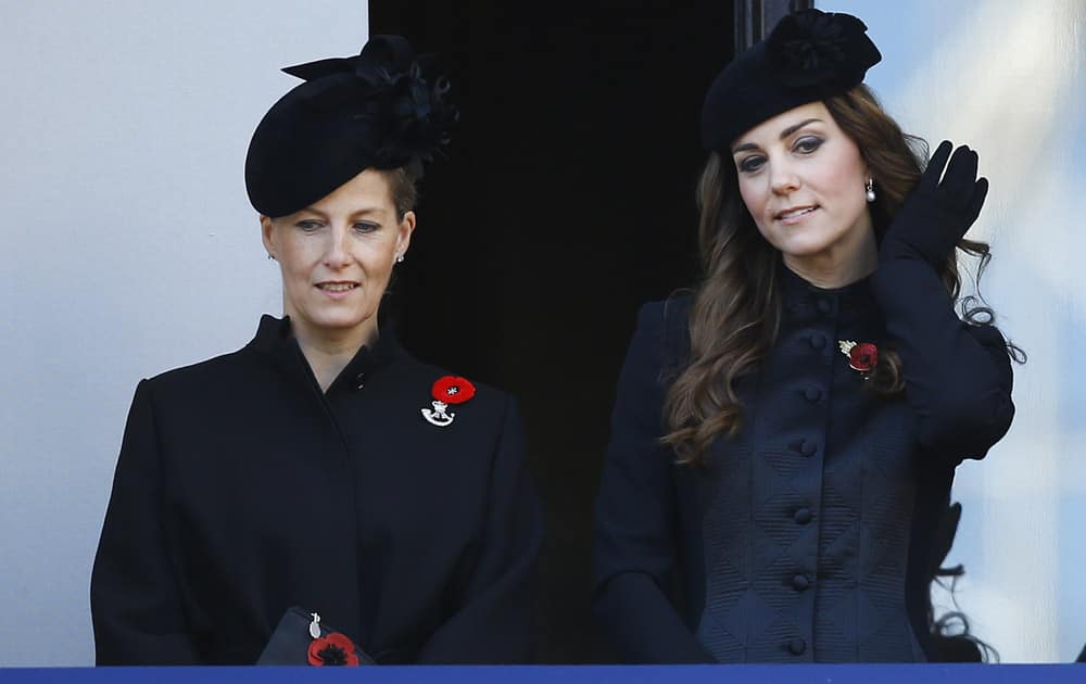 Britain`s Kate, the Duchess of Cambridge, right, and Sophie, the Countess of Wessex listen from a balcony during the service of remembrance at the Cenotaph in Whitehall, London.