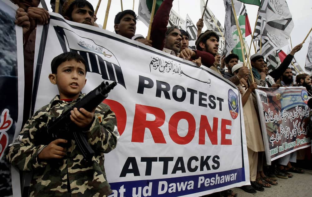 Supporters of a Pakistan religious group, Jamaat-ud-Dawwa, chant slogans during a protest to condemn U.S. drone attacks, in Peshawar.