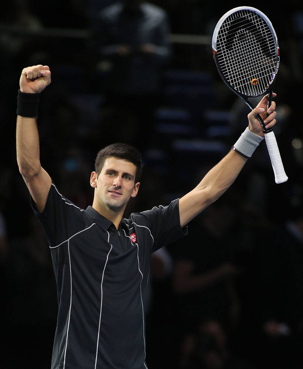 Novak Djokovic of Serbia celebrates after he defeats Richard Gasquet of France in their ATP world Tour Finals tennis match at the O2 Arena on London.