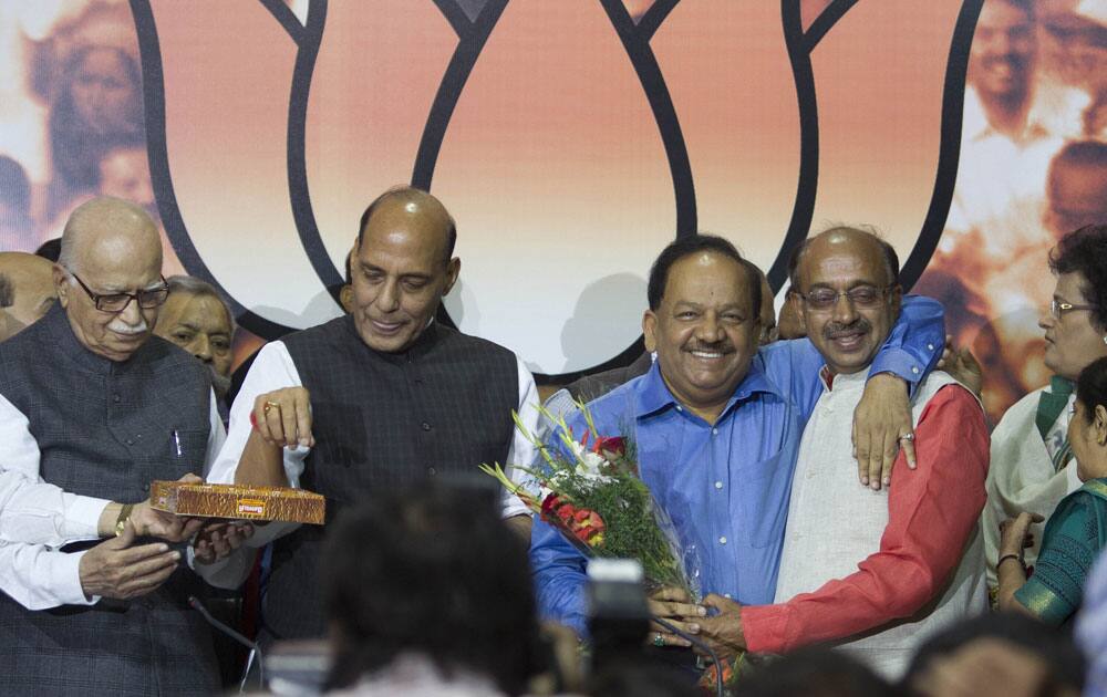 Bharatiya Janata Party`s chief ministerial candidate for the upcoming Delhi state elections Harsh Vardhan, is greeted by BJP’s Delhi chief Vijay Goel.