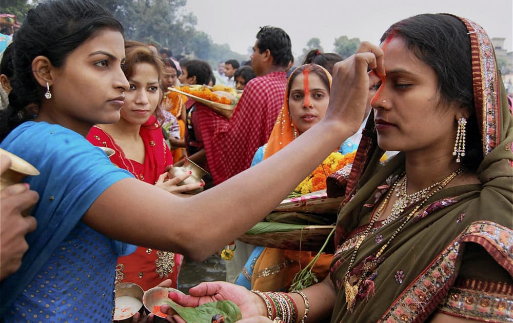 Women devotees perform rituals on the occasion of Chhath festival in Deoghar district of Jharkhand.