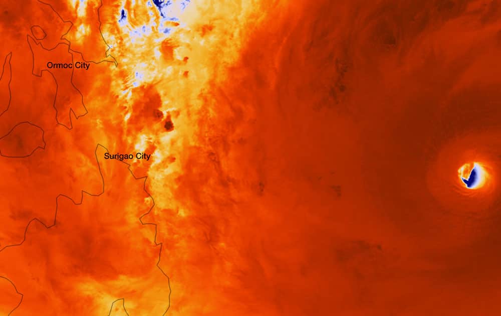 Satellite image provided by the National Oceanic and Atmospheric Administration shows the eye, right, of Typhoon Haiyan, off the coast of the Philippines, at approximately 05:25 UTC (12:25 a.m. EST).