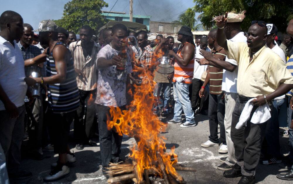 Demonstrators perform a voodoo ceremony before the start of anti-government protest in Port-au-Prince, Haiti.