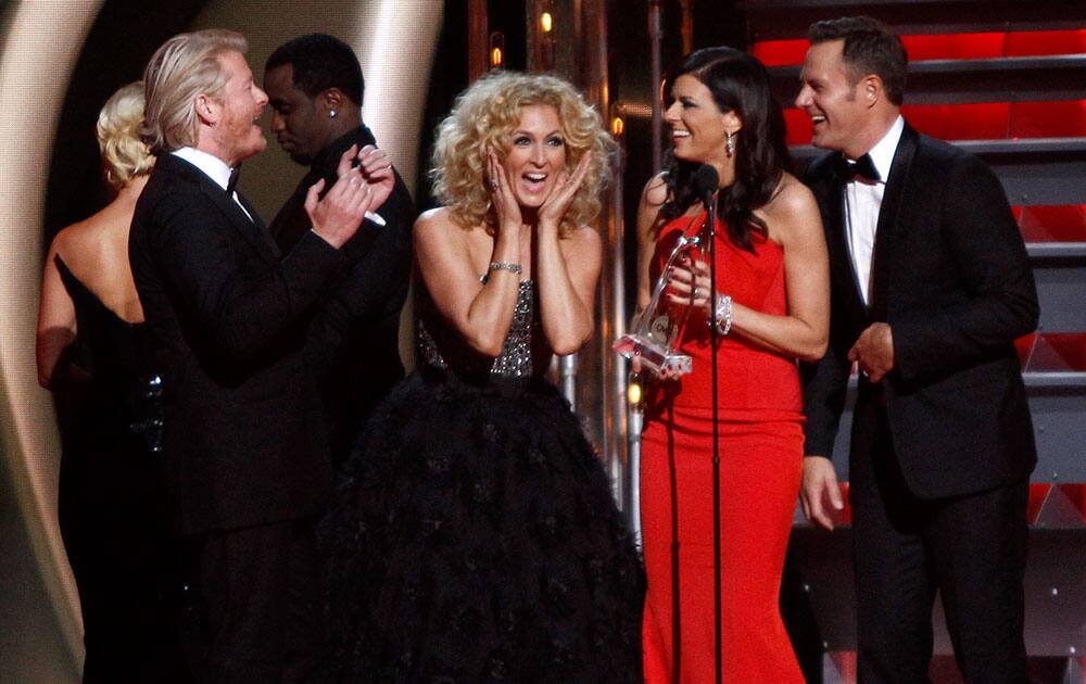 Philip Sweet, from left, Kimberly Schlapman, Karen Fairchild, and Jimi Westbrook, of Little Big Town, accept the award for vocal group of the year at the 47th annual CMA Awards at Bridgestone Arena in Nashville, Tenn.