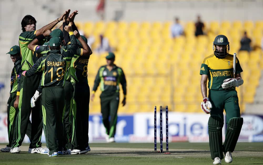 South Africa`s Hashim Amla walks off the pitch after losing his wicket to Pakistan’s bowler Mohammad Irfan during the third cricket one-day international match of a five match series between Pakistan and South Africa at the Zayed Cricket Stadium, in Abu Dhabi.