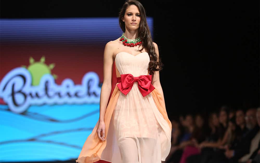 A model wears a creation from the Jessica Butrich 2014 Spring/Summer collection during Fashion Week in Lima, Peru.