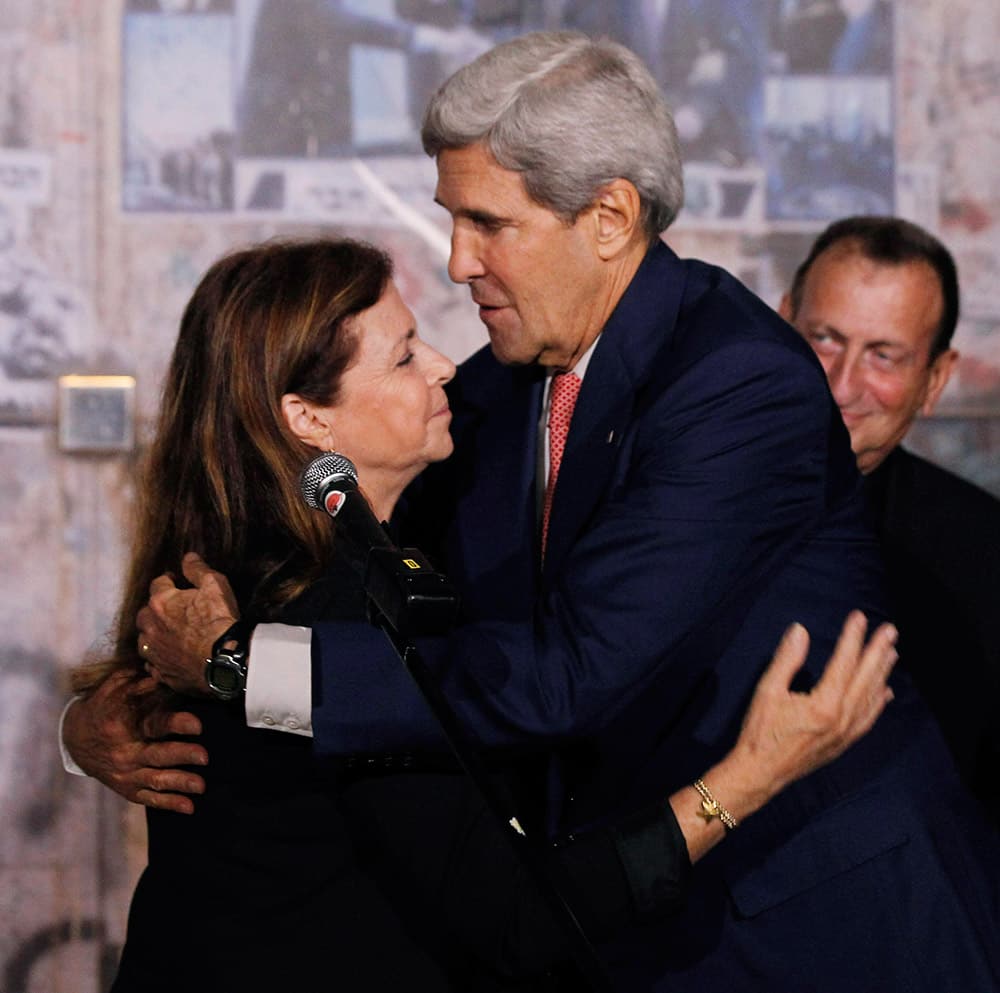 Secretary of State John Kerry hugs Dalia Rabin-Pelossof, daughter of assassinated Israeli Prime Minister Yitzhak Rabin, following a wreath laying at Rabin Square in Tel Aviv, Israel.