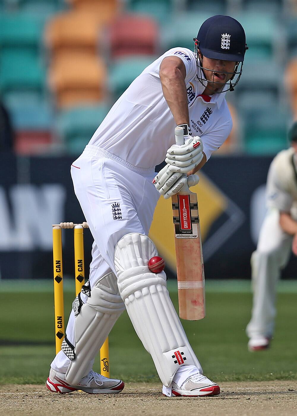 England`s captain Alastair Cook pads up to the ball from Australia A`s Moises Henriques during their cricket tour match in Hobart.