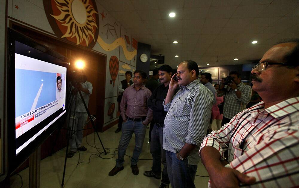 Indians watch the live telecast of the launch of Polar Satellite Launch Vehicle (PSLV-C25) rocket carrying India`s Mars spacecraft from the east-coast island of Sriharikota in New Delhi.
