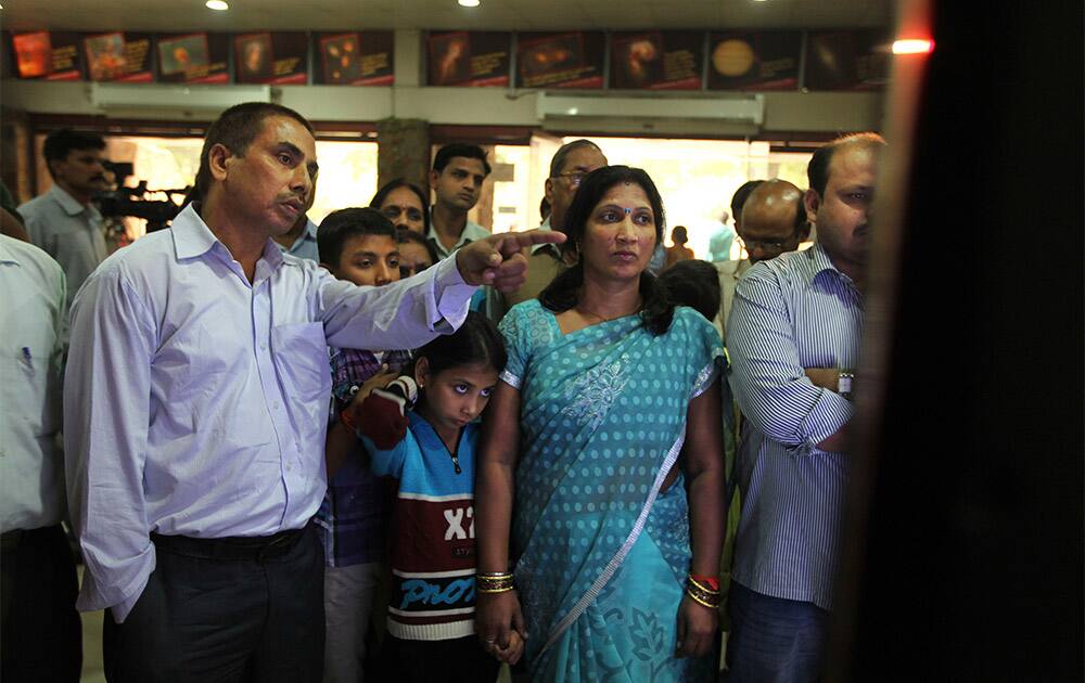 Indians watch the live telecast of the launch of Polar Satellite Launch Vehicle (PSLV-C25) rocket carrying India`s Mars spacecraft from the east-coast island of Sriharikota, in New Delhi.